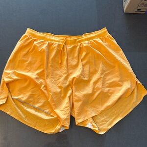 Neon orange lululemon running shorts